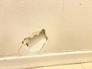 Comment réparer un trou dans le mur à l'aide de Spackle