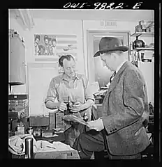 Carlson examining blueprints