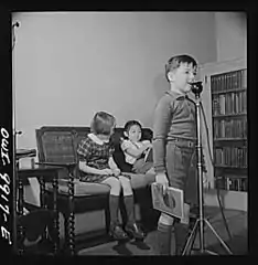 First-grader pupils, having their voices recorded for diction correction
