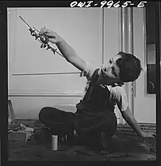 German refugee child playing with airplane models