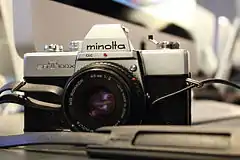 Minolta SRT 100X (E) = SR-T 200 (A) (1977)