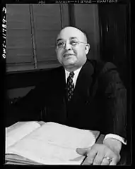 Postmaster Robert Pautz chatting with two friends