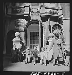 Pupils being taken for a walk. They hold hands in order not to get lost or run over